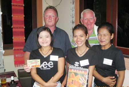 Tuesday’s top two, John Bartley, left, and Mike Gerrard, center, with the staff at The Relax Bar.